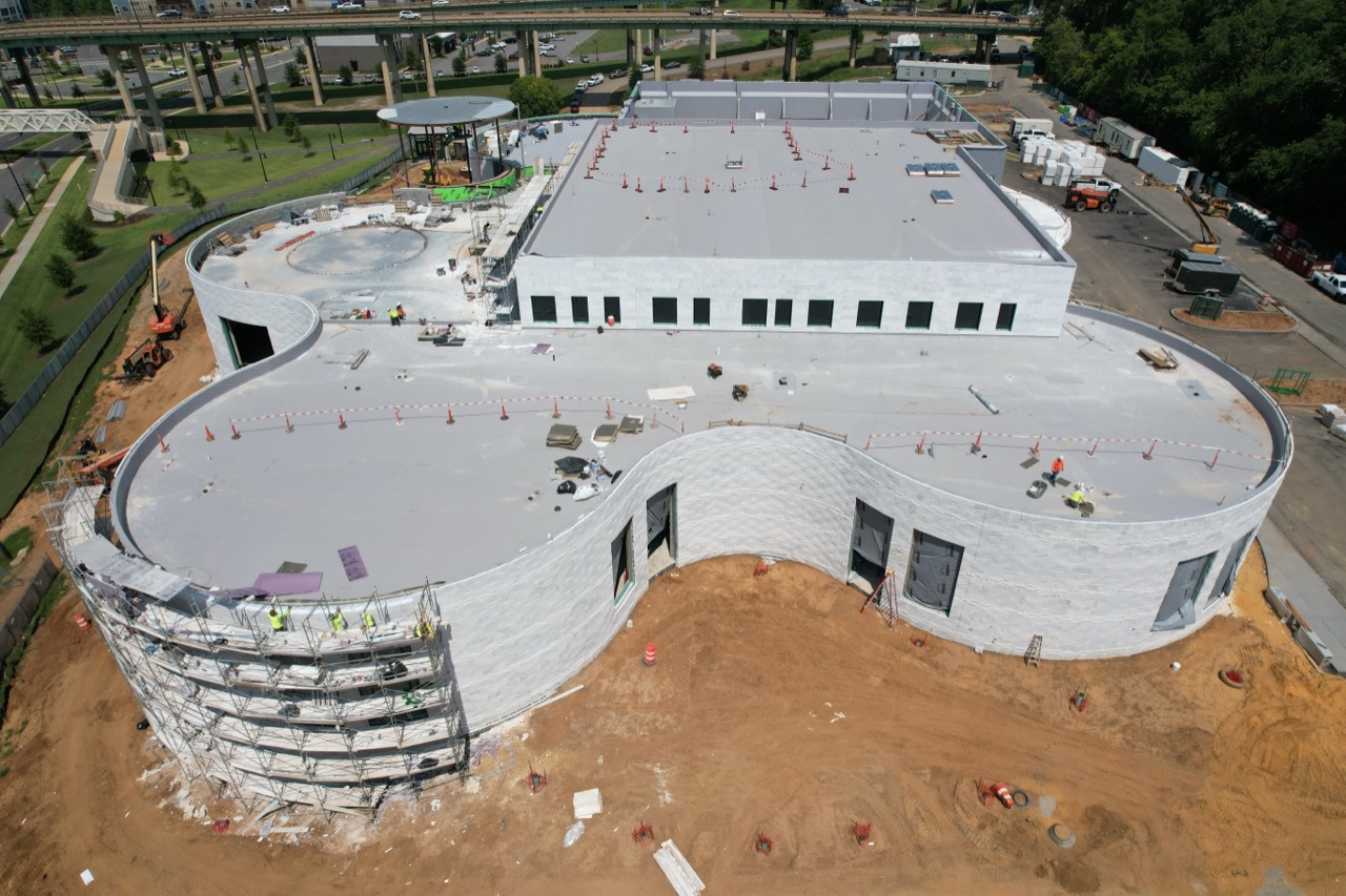 Aerial construction view of the Saban Center's curved Alabama White marble exterior in Tuscaloosa
